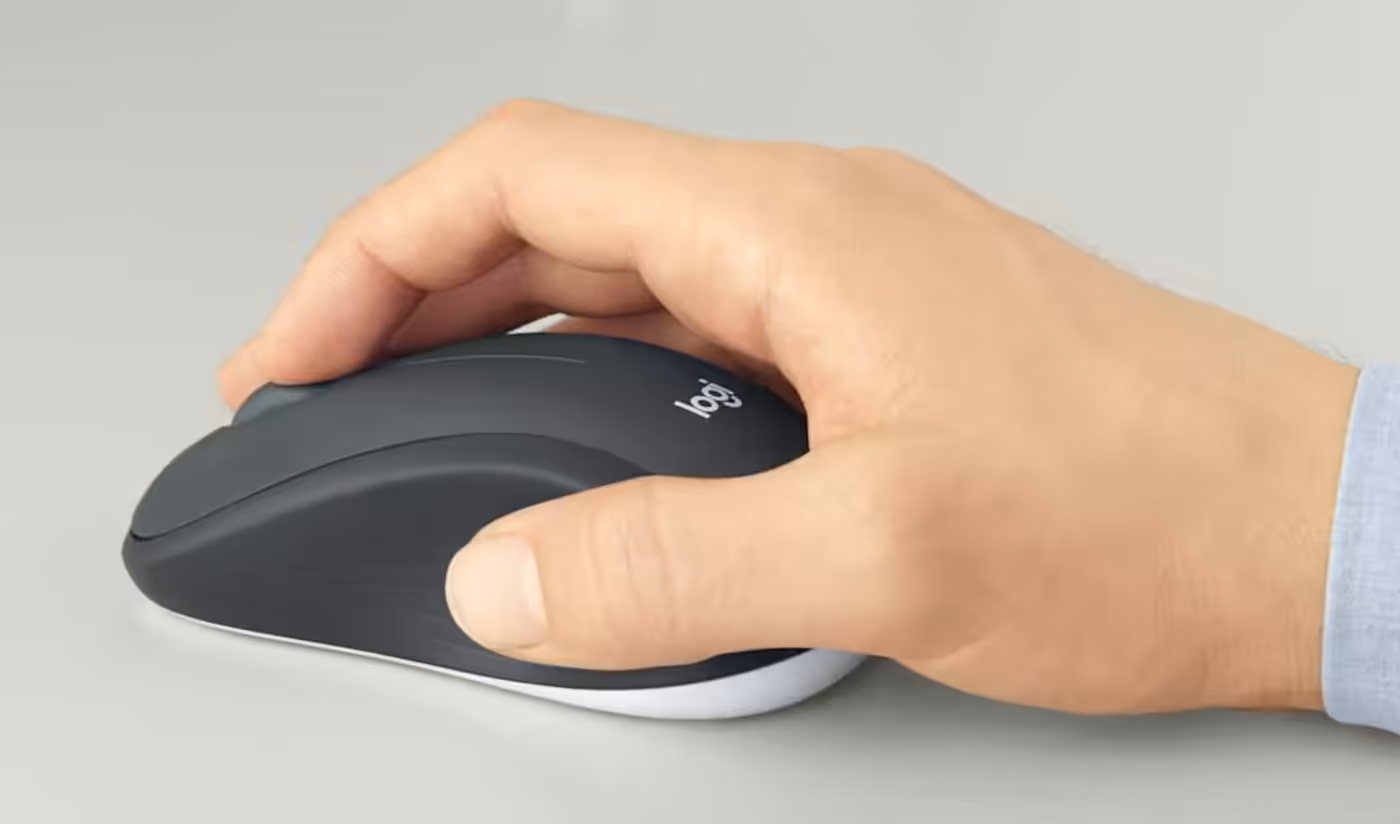 Contoured wireless mouse with soft rubber grips for either hand