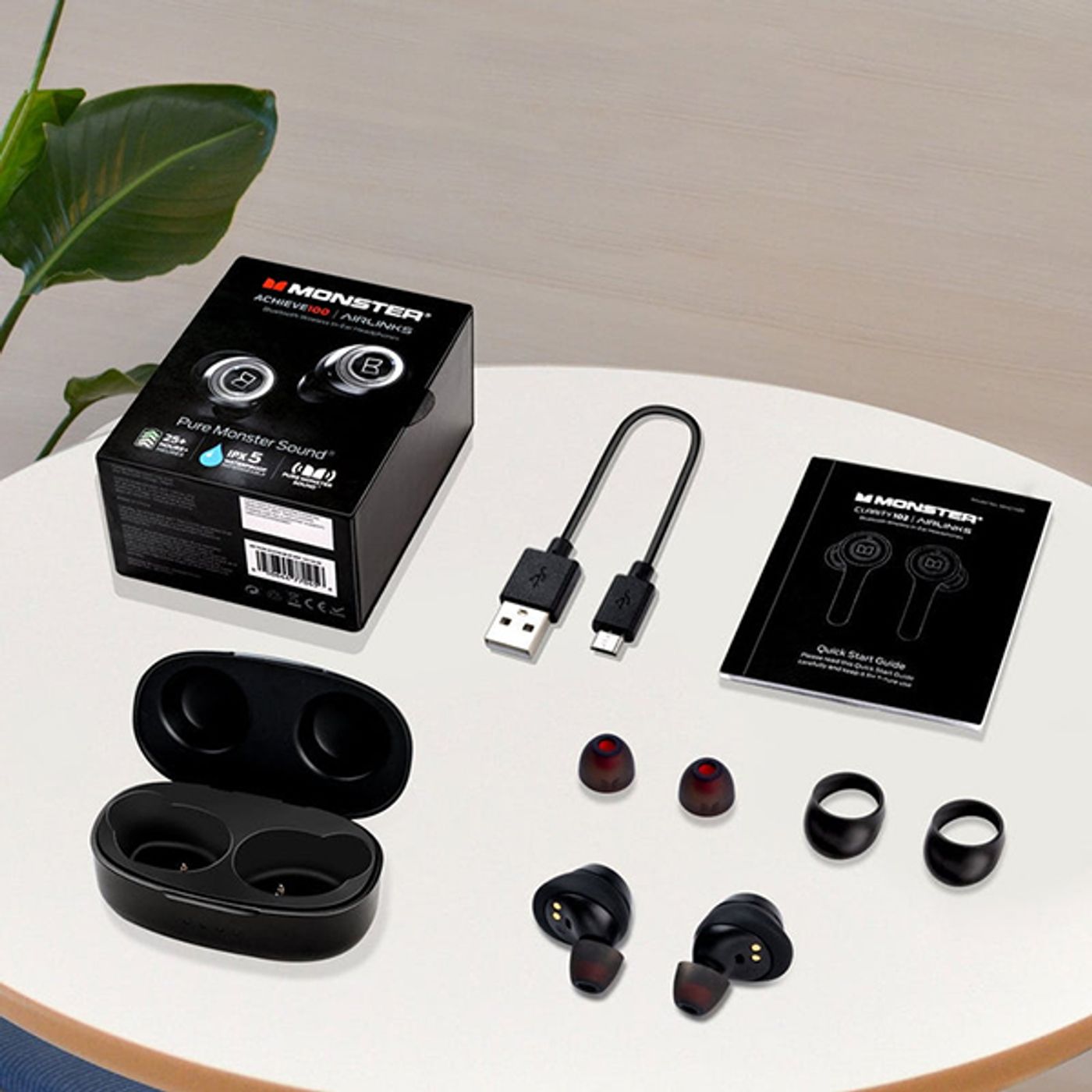 Monster AirLinks earbud showing the Multi-Function Button on its face