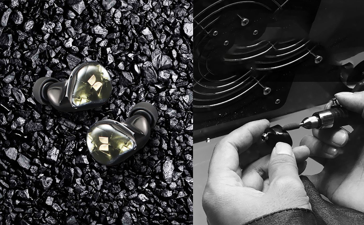 Water droplets on the blue housing of a Monster Clarity 700DB earbud