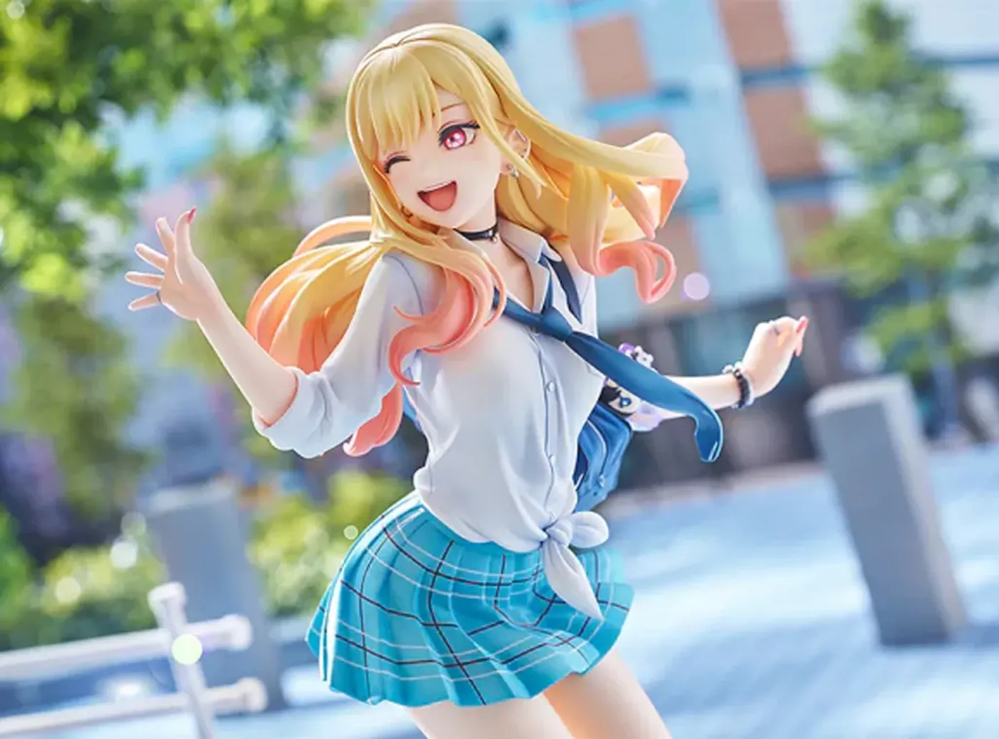 Full-height view of the 23cm Marin Kitagawa figure on its dedicated stand
