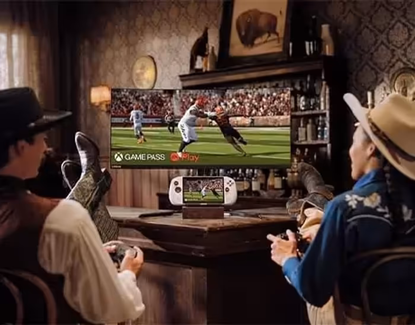 Two people gaming on a TV using Lenovo Legion Go S Gen 1 (8") gaming handheld as the controller in a cozy room.