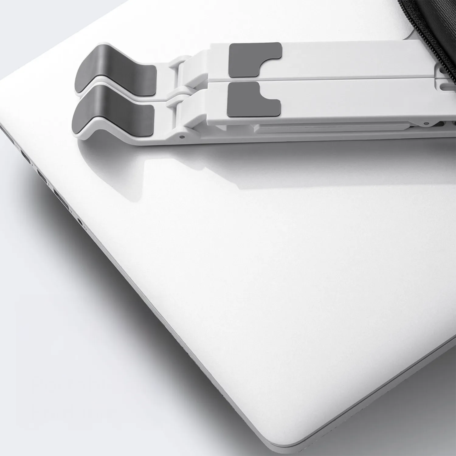 Folded ORICO stand showing compact 190 g portability