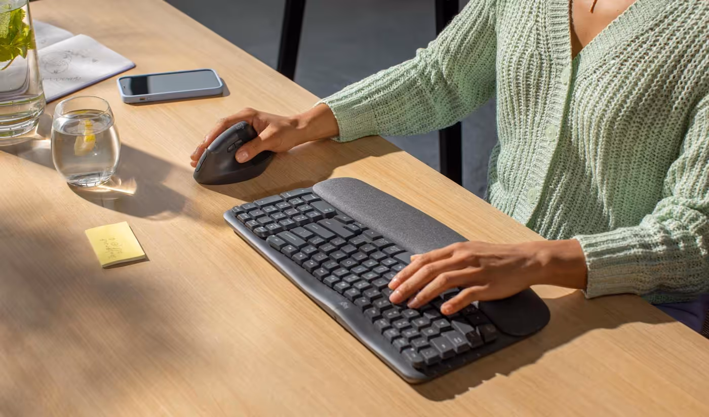 Person using Lift mouse for quiet, focused all-day work