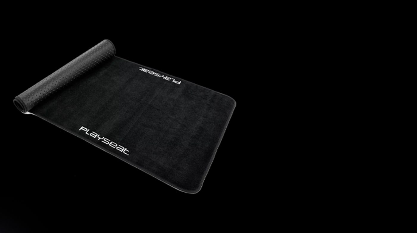 Playseat Floor Mat XL laid out flat with the Playseat logo visible on the surface