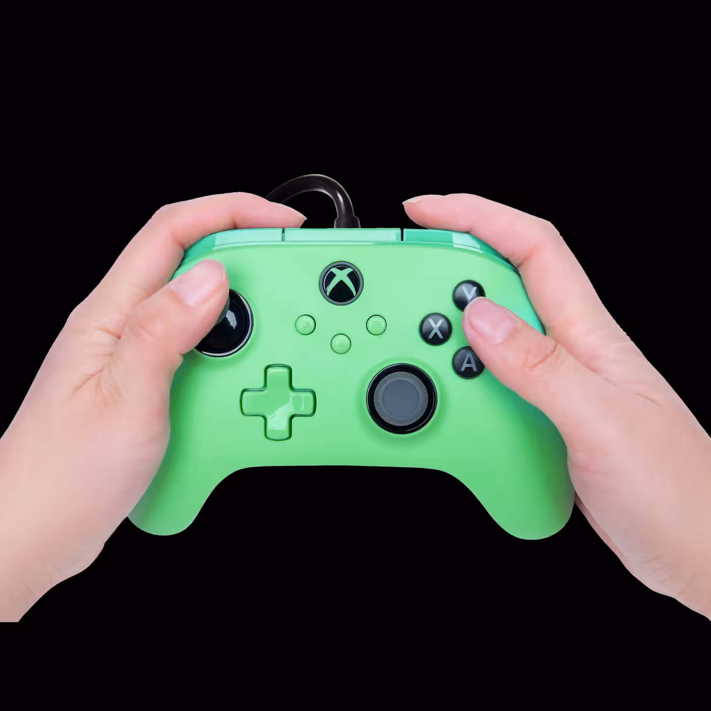 Hands holding the Green Meadow PowerA Advantage Plus controller