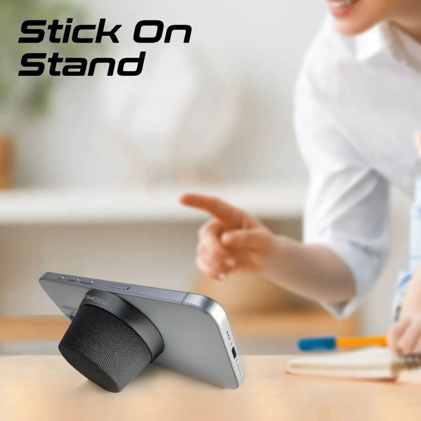 Promate PUNCH speaker in black packed alongside travel items