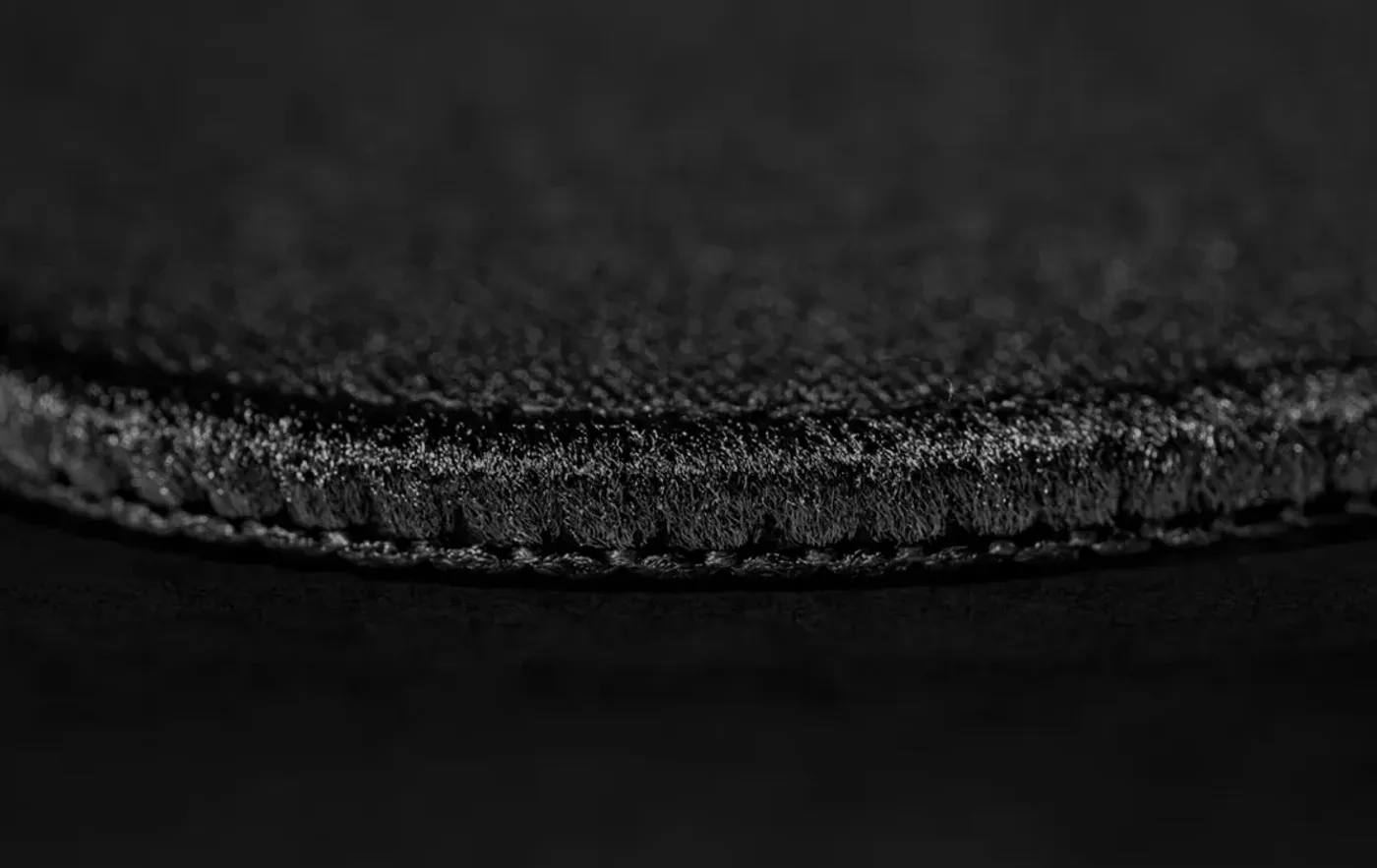 Reinforced stitched edges of gaming mouse pad for durability