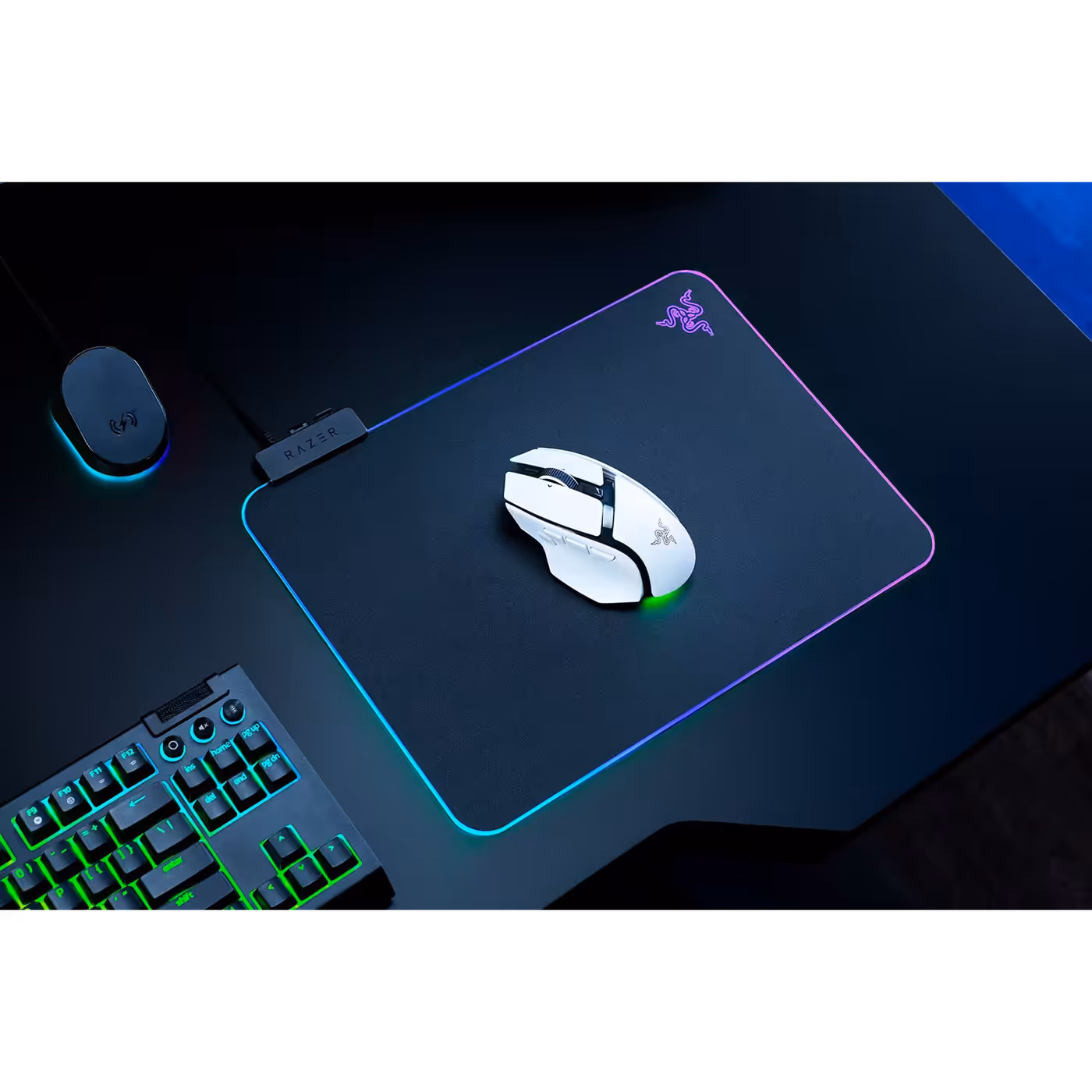 Top view of the white Razer Basilisk V4 HyperSpeed on a lit mouse mat beside a keyboard