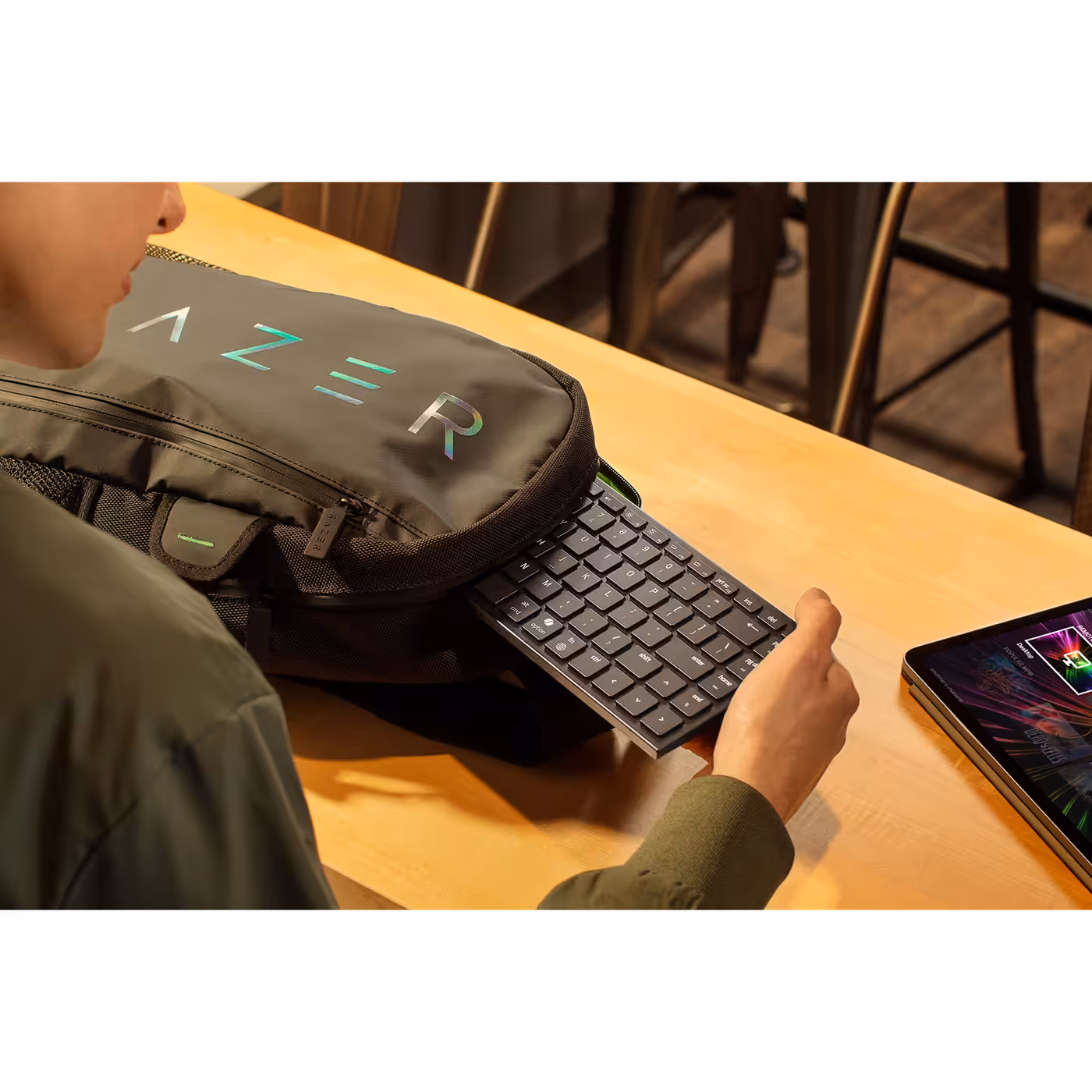 Razer Joro keyboard being slipped into a Razer backpack