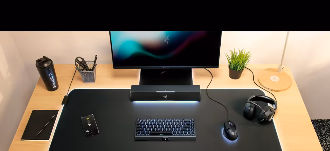 Compact Razer Leviathan V2 X soundbar positioned under a computer monitor