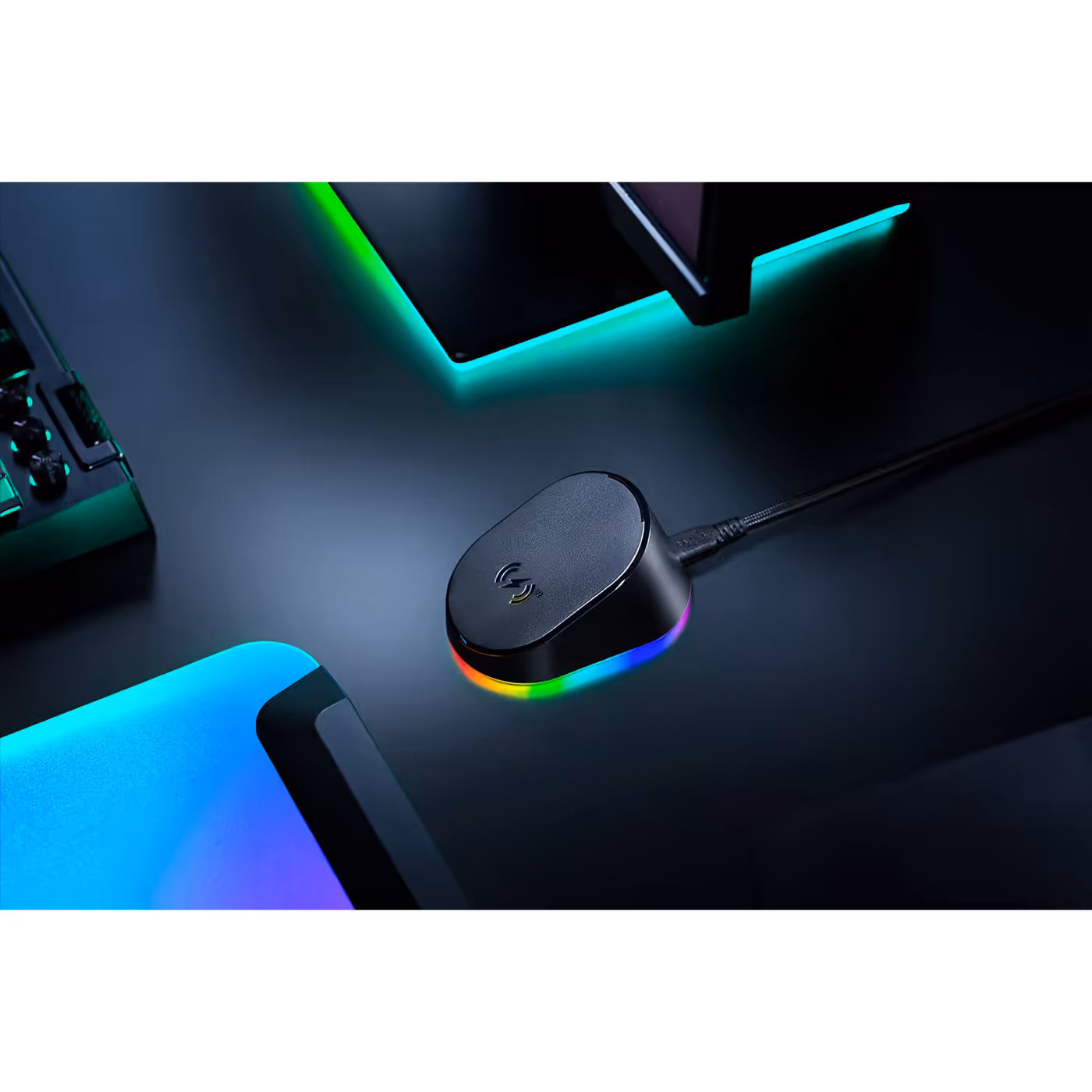 Razer Mouse Dock V2 Pro on a desk with its underglow lit