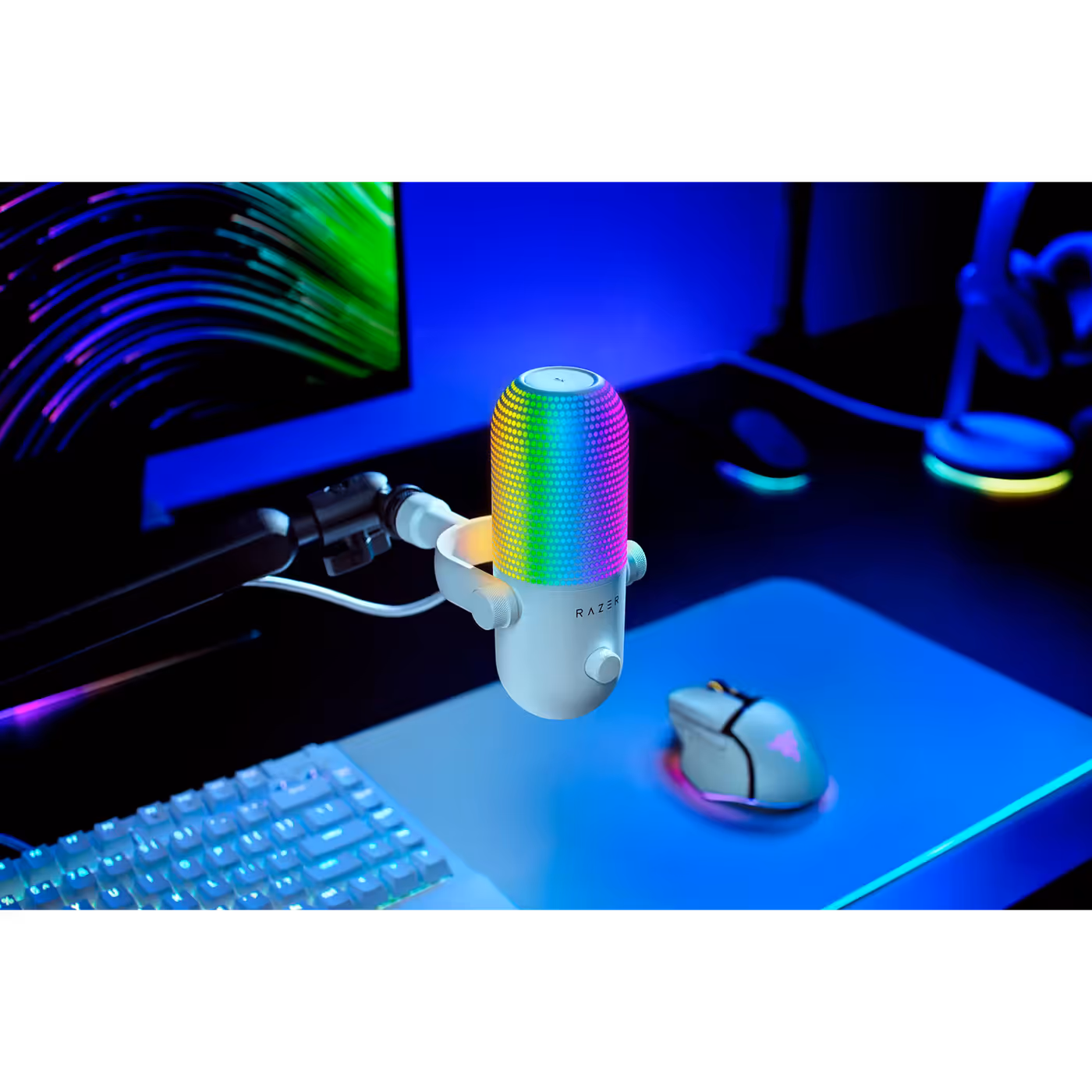 Razer Seiren V3 Chroma mounted on a boom arm at a desk