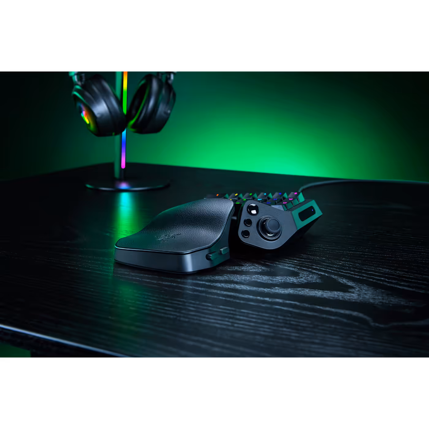 Razer Tartarus V2 Pro on a desk under green lighting