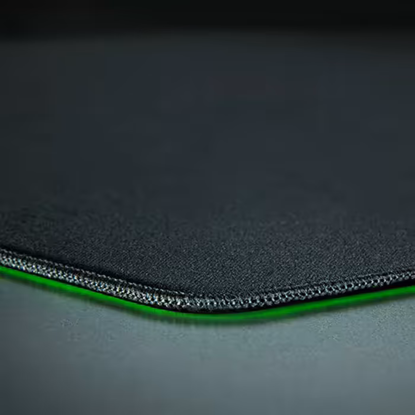 Detail view of the low-profile stitched edges on the gaming mouse mat