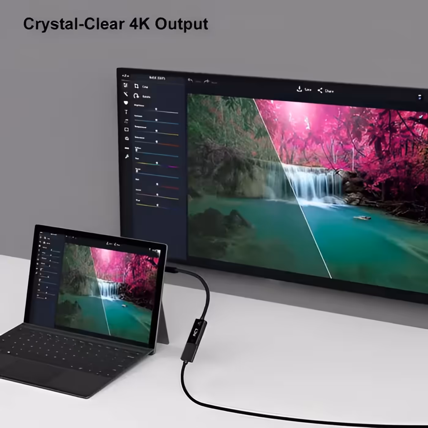 Compact black RCT ADP-MDPHDMI adapter shown next to a laptop