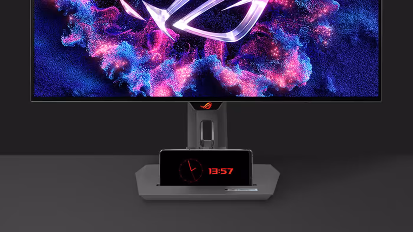 Monitor stand with a mobile device groove and compact base