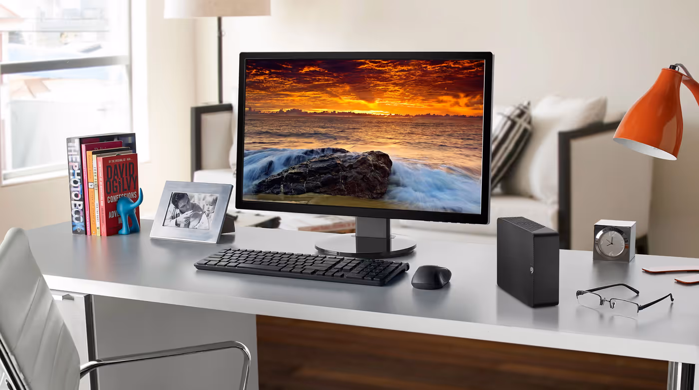 Desktop computer with Seagate Expansion Desktop hard drive connected for quick plug-and-play storage