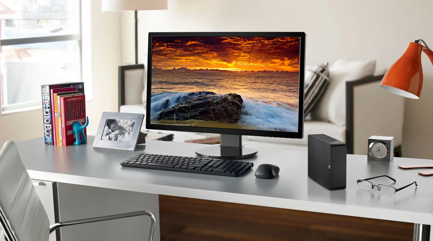 Desktop computer with Seagate Expansion Desktop hard drive connected for quick plug-and-play storage