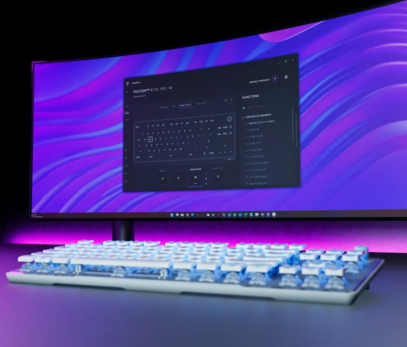A gaming keyboard in the foreground with a curved monitor displaying a colorful interface and keyboard settings.