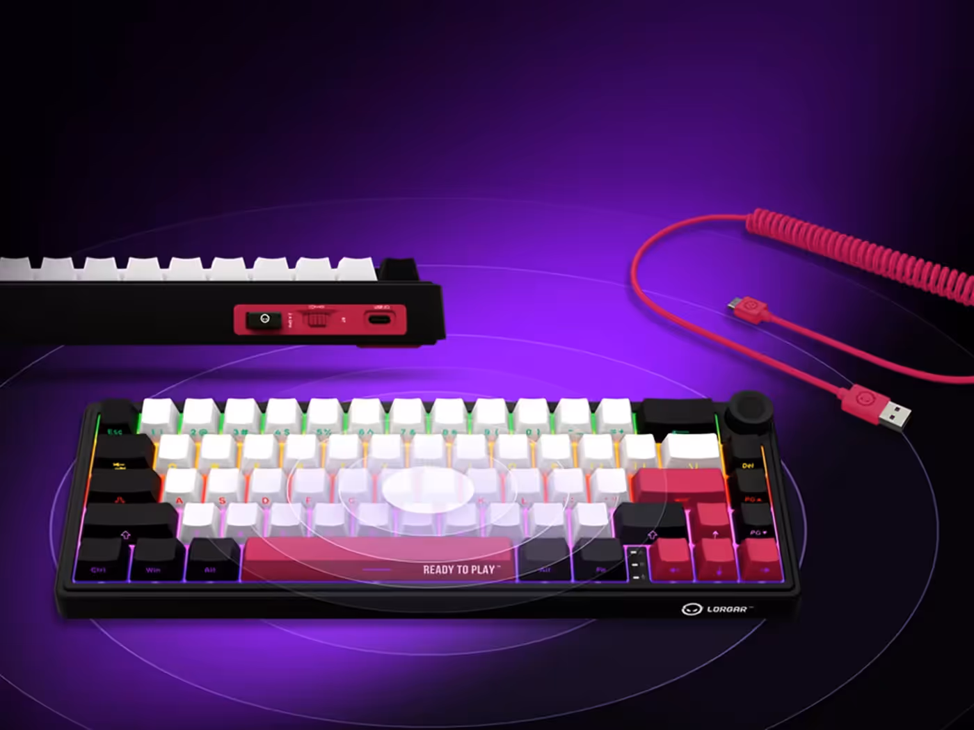 Wireless gaming keyboard shown with its coiled detachable cable