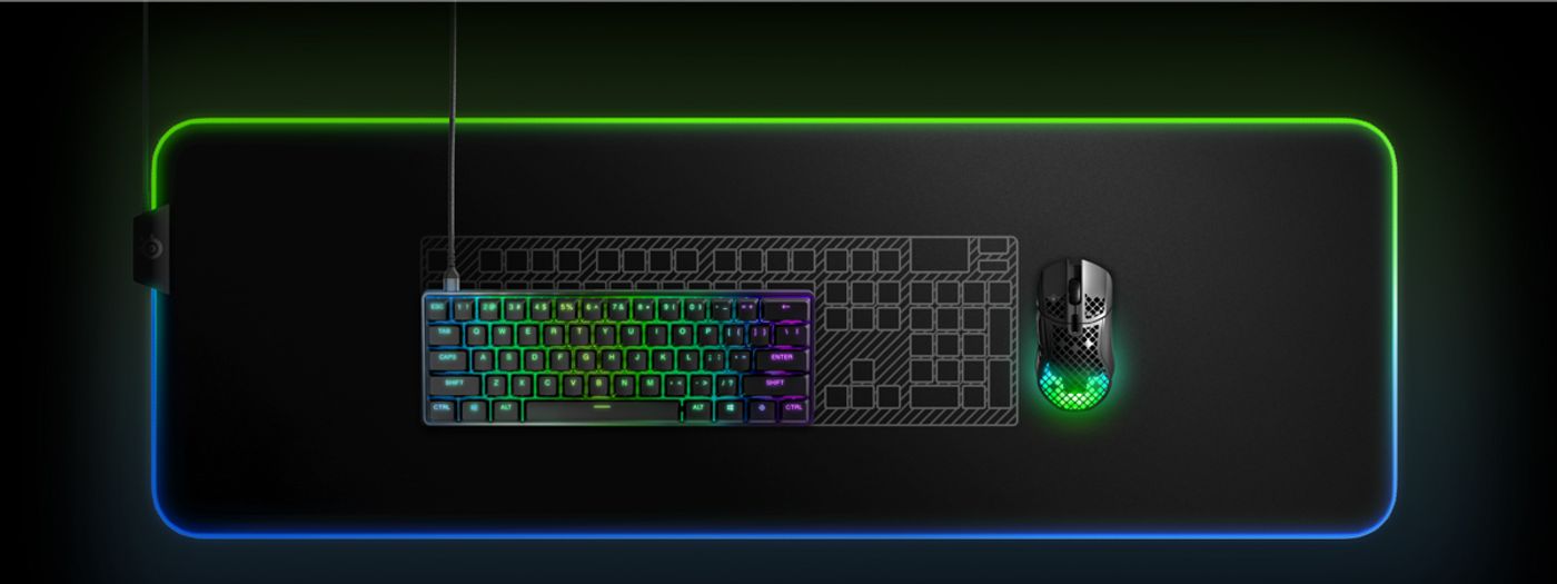 The Apex 9 Mini on a desk beside a mouse, showing how little space the 60% layout takes