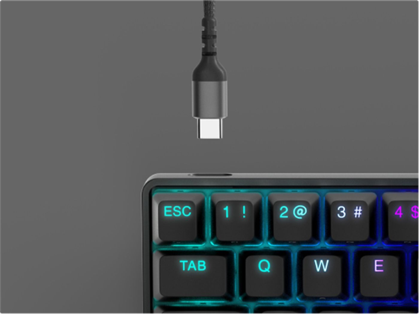 The detachable braided USB Type-C cable next to the keyboard USB-C port