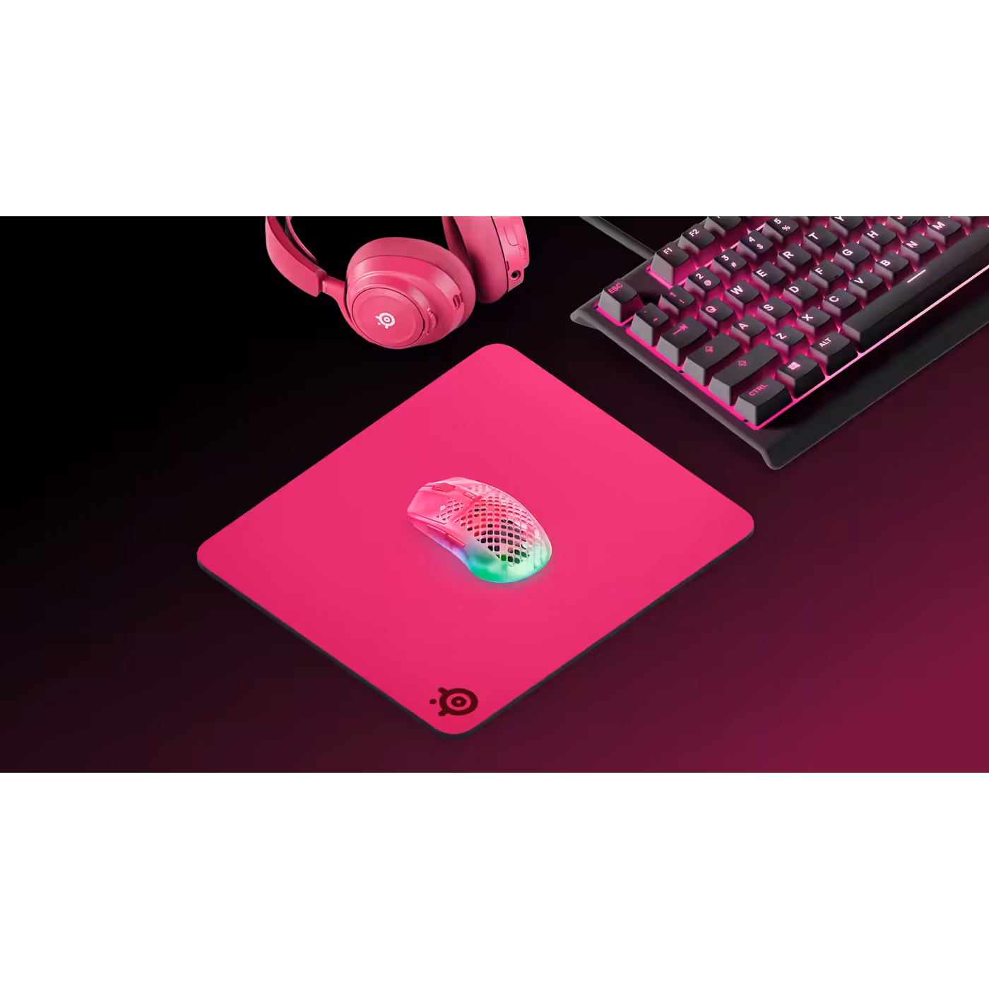 QcK Heavy Large Magenta in a matching SteelSeries desk setup