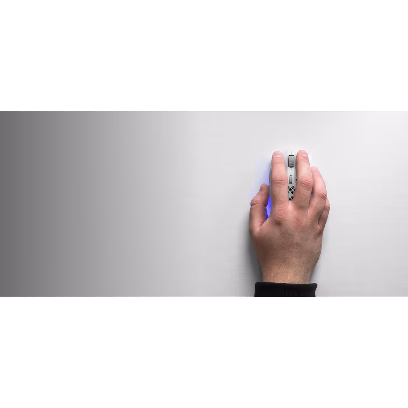 Hand and mouse on the white QcK Heavy cloth surface