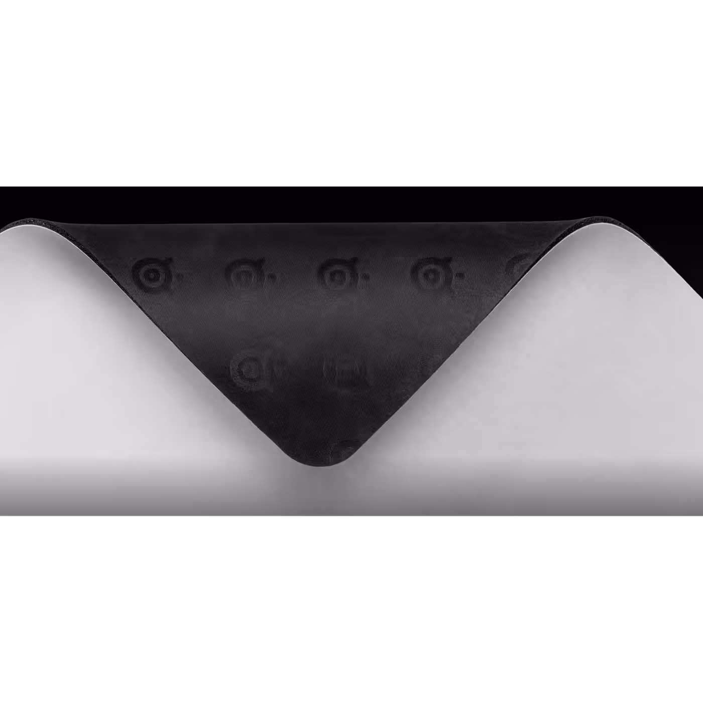 Corner of the QcK Heavy lifted to show the non-slip rubber base