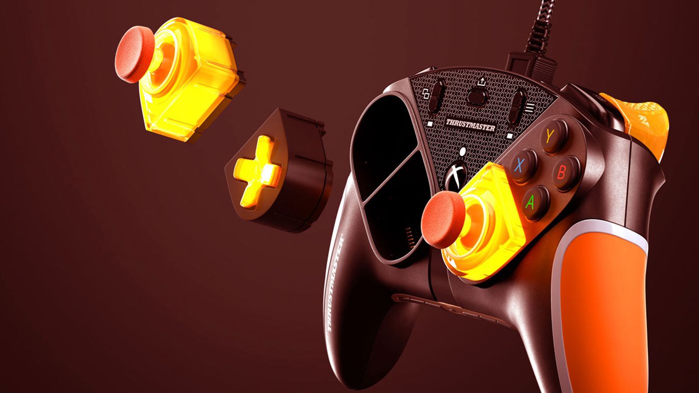 Thrustmaster eSwap LED Orange Crystal Pack modules laid out in their orange finish