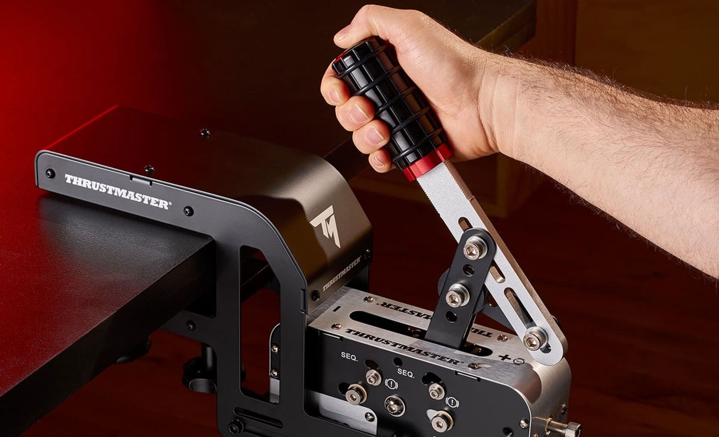 TM Racing Clamp mounted to a desk edge holding a Thrustmaster add-on