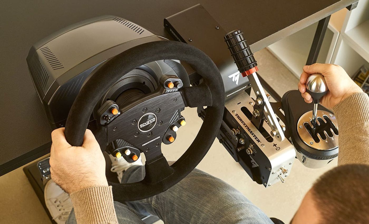 TM Racing Clamp shown as part of a complete Thrustmaster sim racing setup