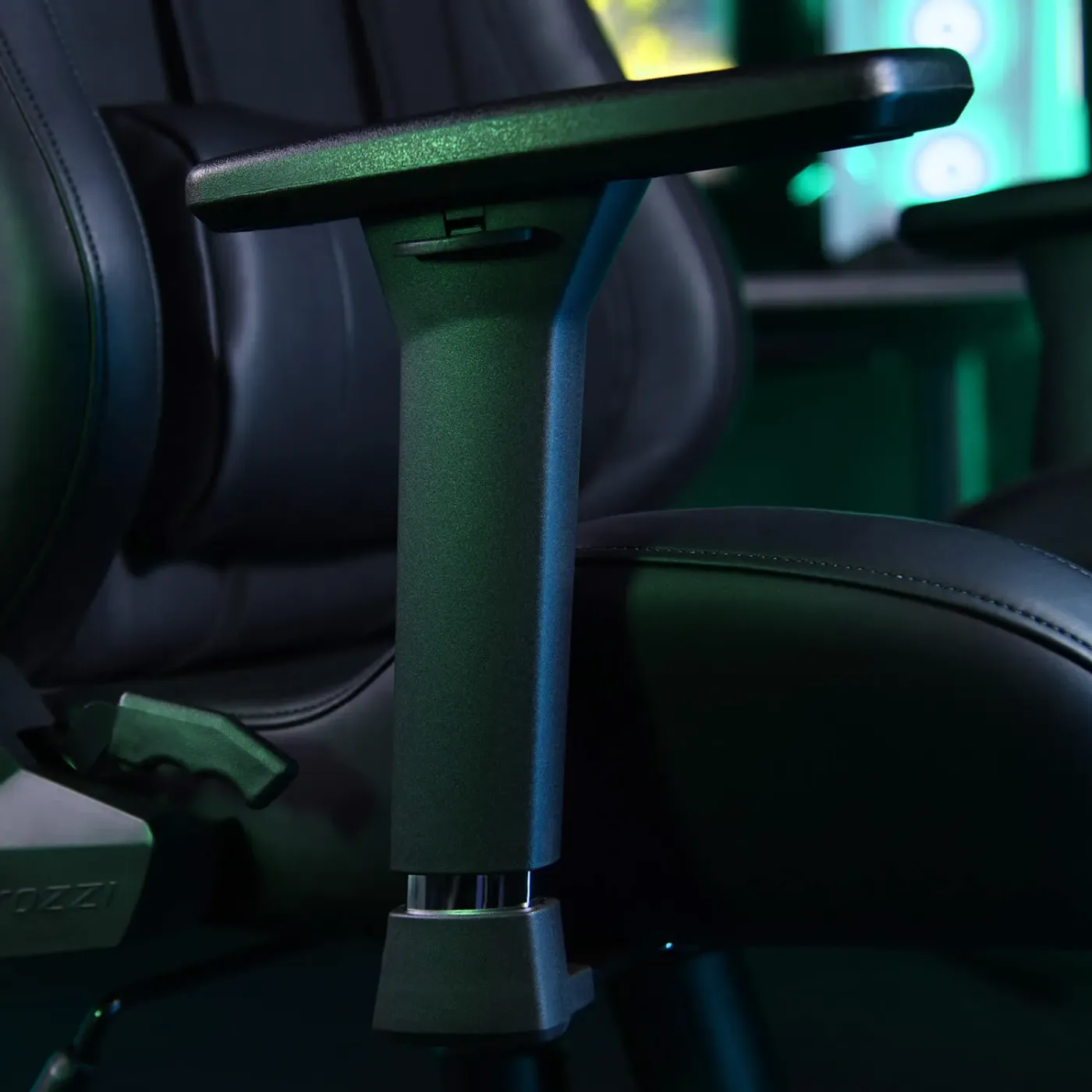 Gaming chair armrests showing 3D adjustment capabilities in three directions