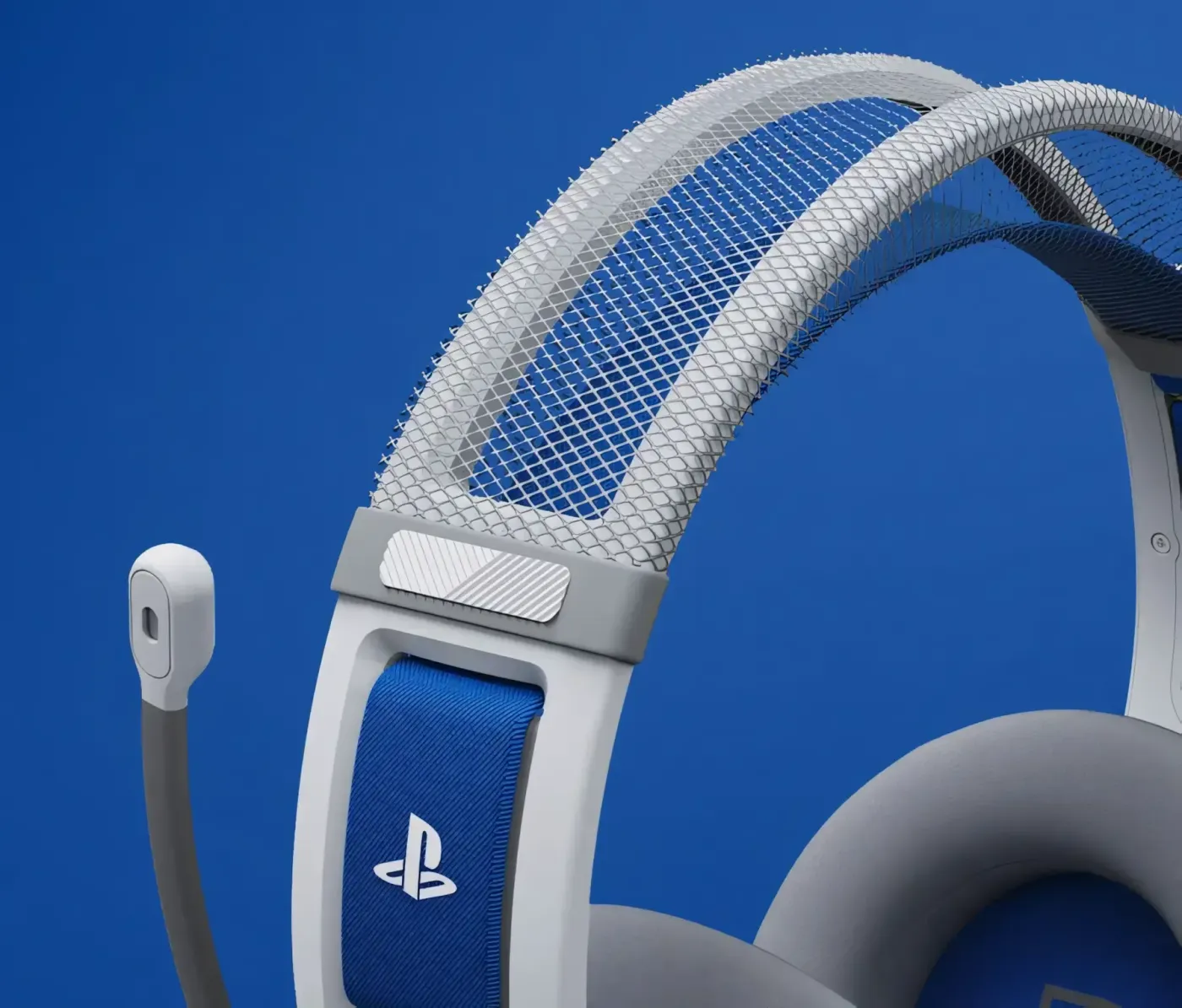 Close-up of white headphones with gray memory foam cushions and blue headband accent