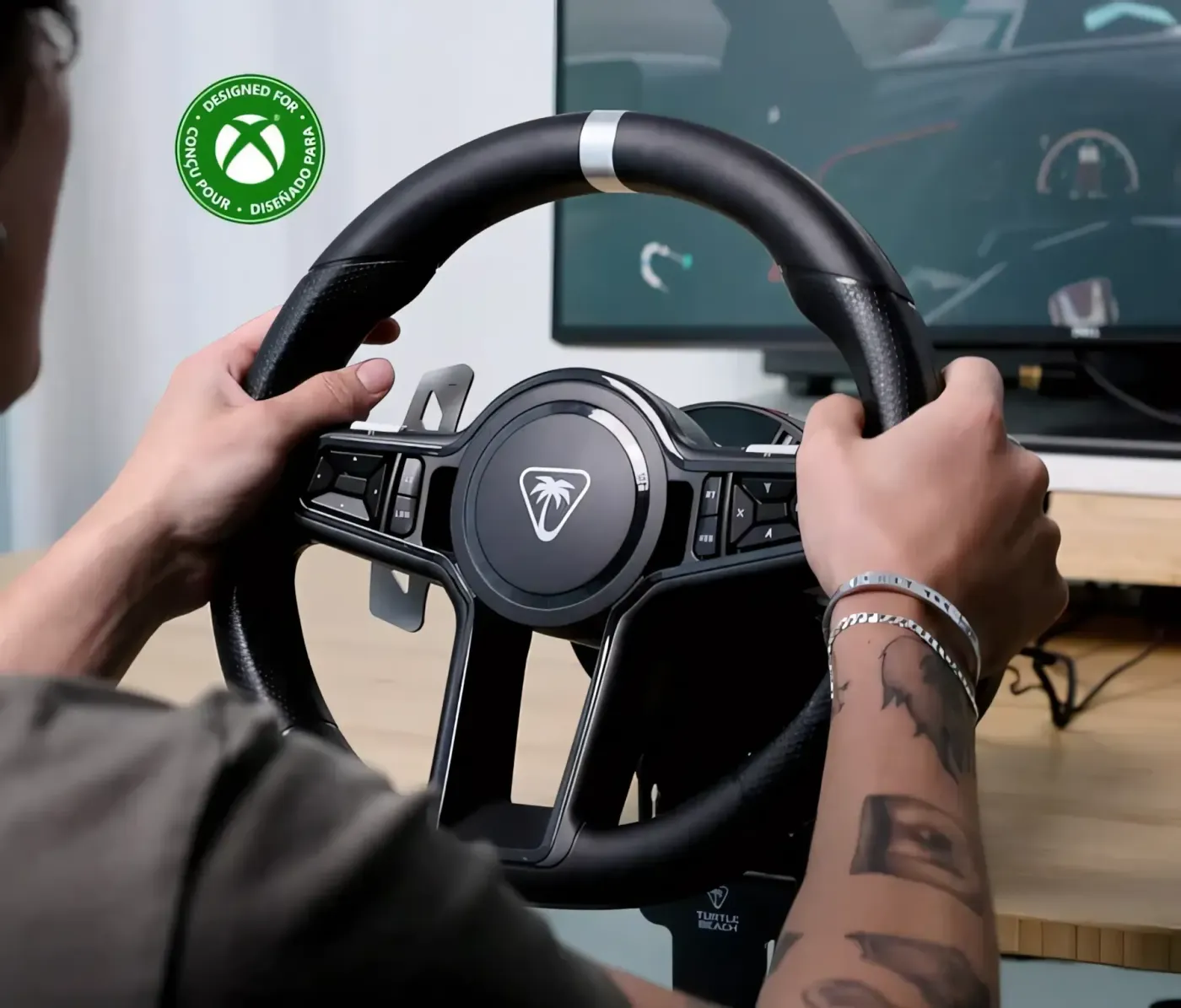 Gamer using racing wheel with VelocityOne Race KD3 system for sim racing
