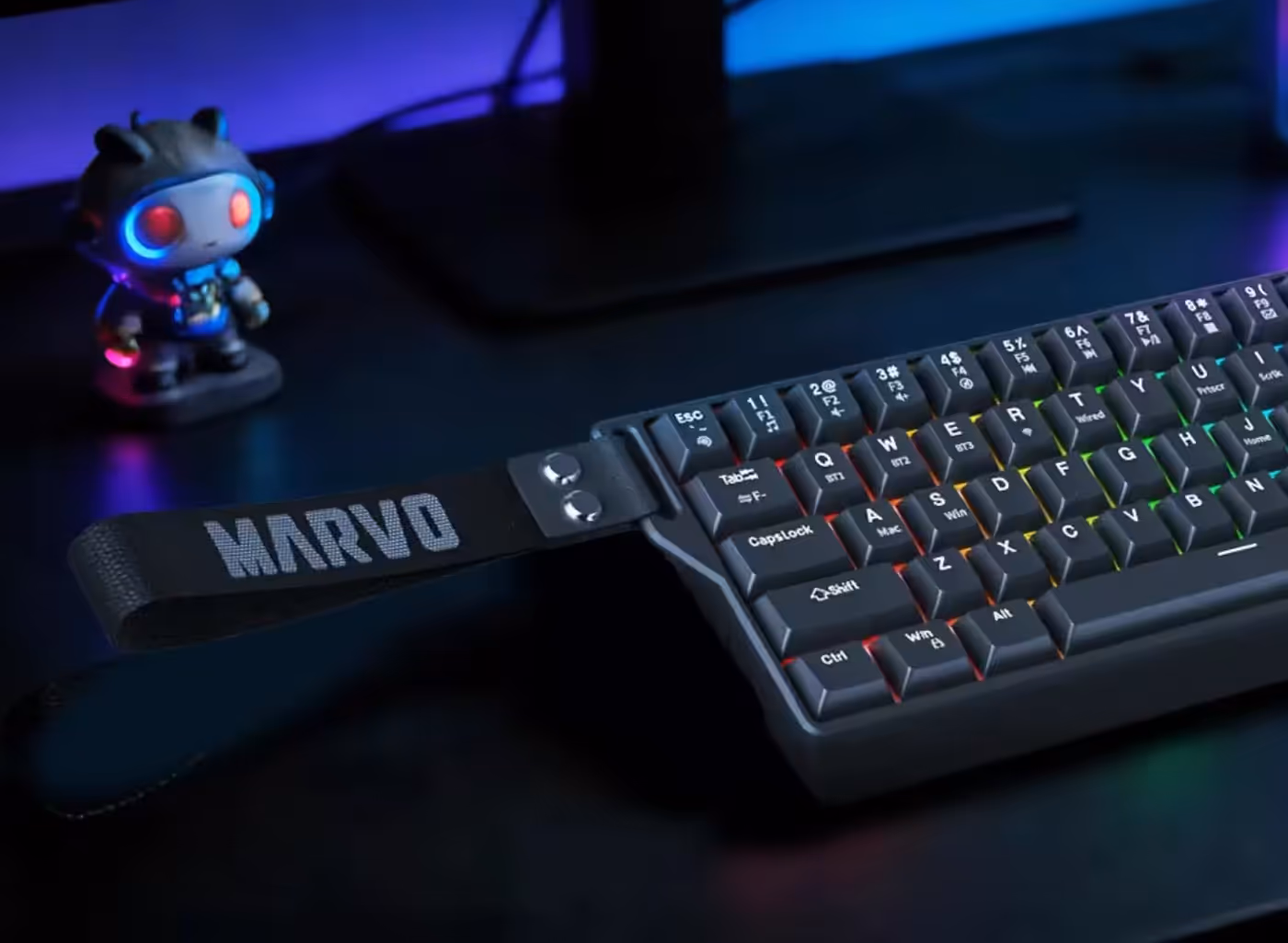 Gaming keyboard including maintenance tools like a ribbon and dedicated screwdriver