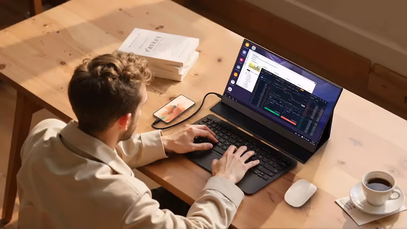 Portable 13.3-inch OLED monitor setup in an indoor professional workspace