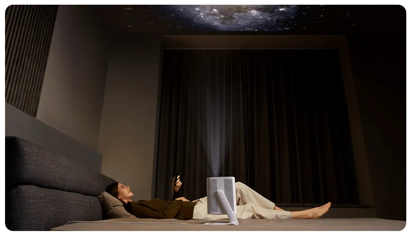 Projector with 200-degree wide-angle gimbal showing flexible positioning capability