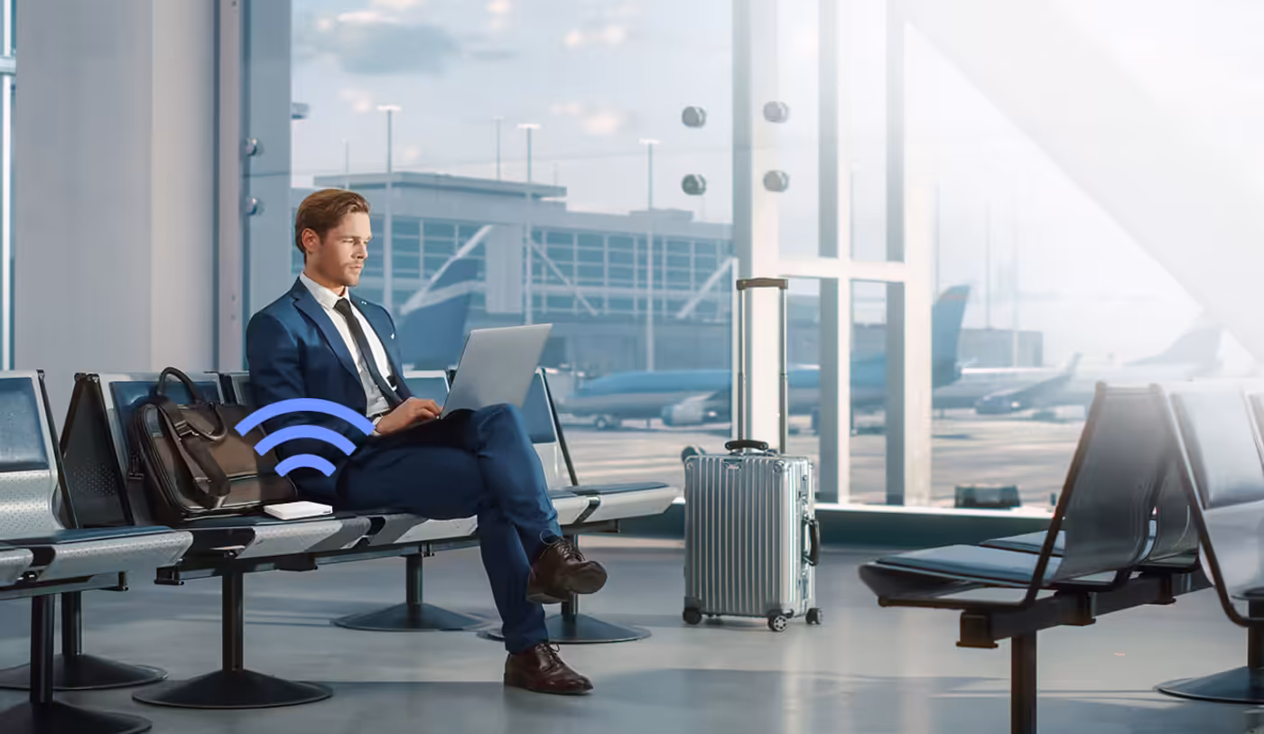 Businessman using VPN on a laptop while traveling