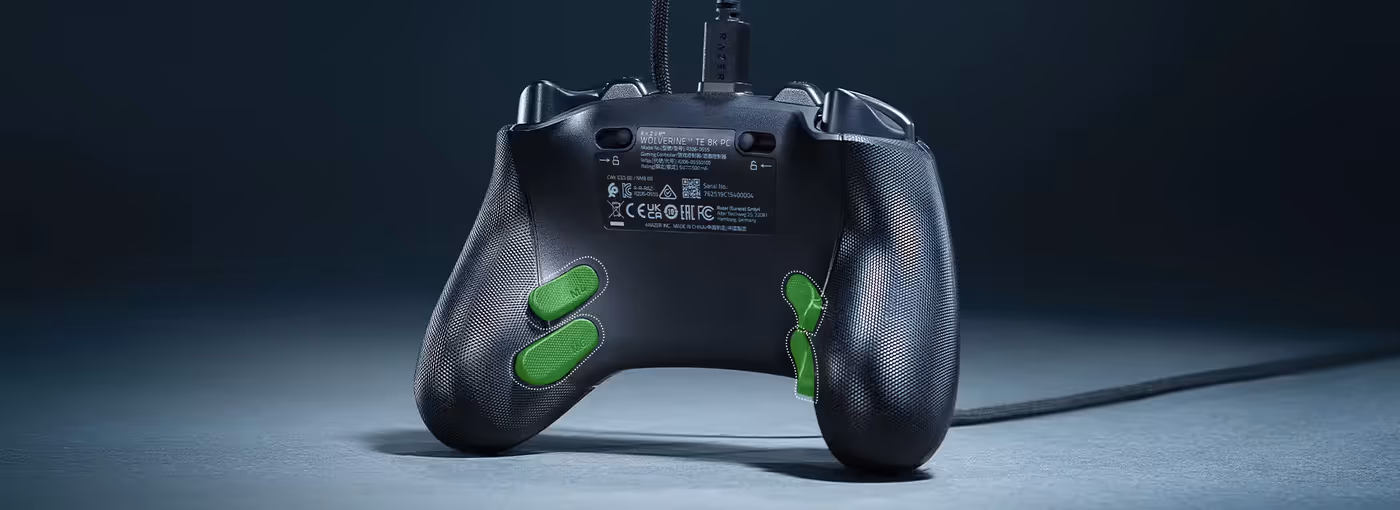 Back of a black Razer Wolverine TE 8K PC controller with green buttons and cable attached.