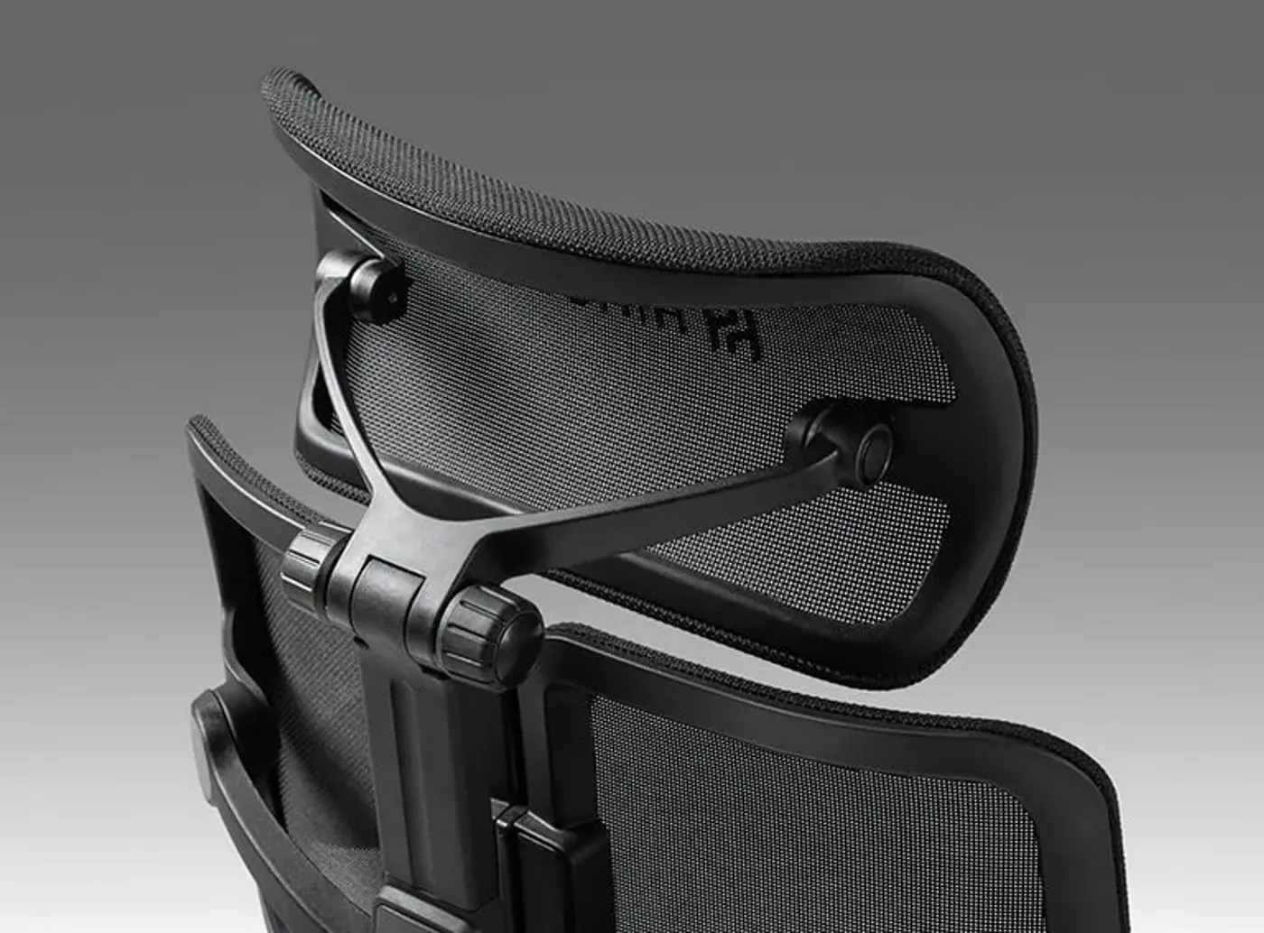 Detailed image of the fully adjustable armrests and shoulder support function