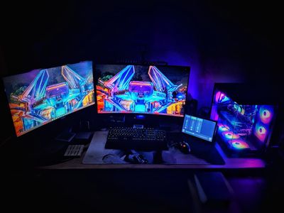 Dual monitor setup with a custom lightsaber build