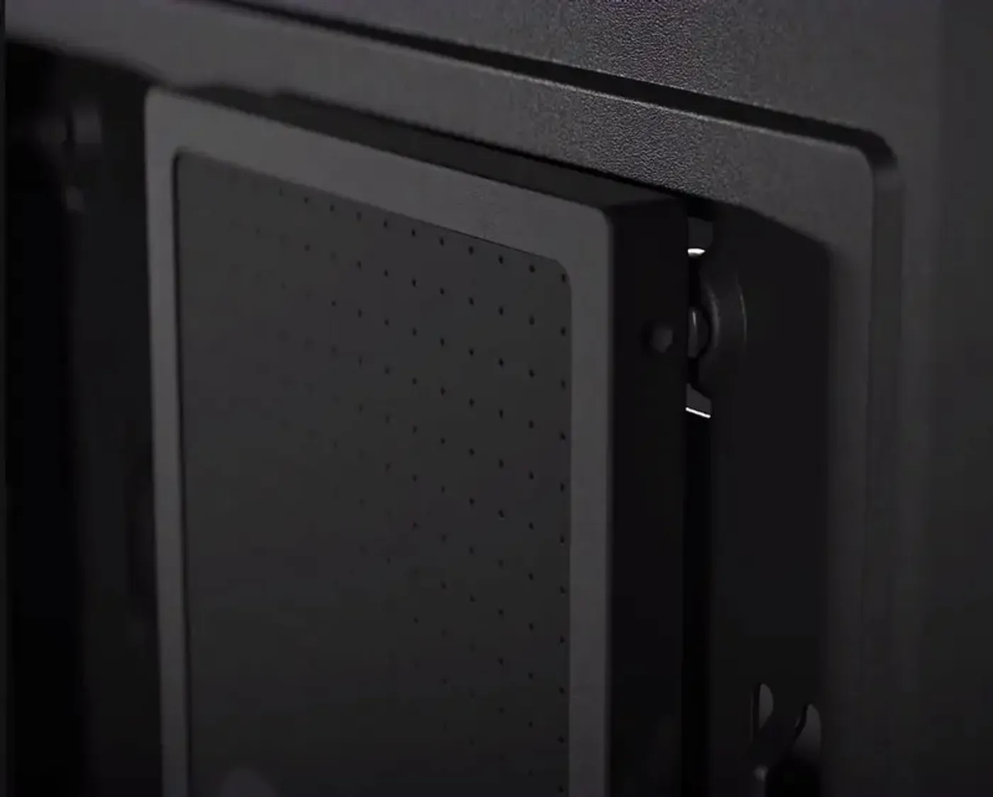 Storage mounting behind the Focus 2 motherboard panel showing SSD quick clips and drive positions