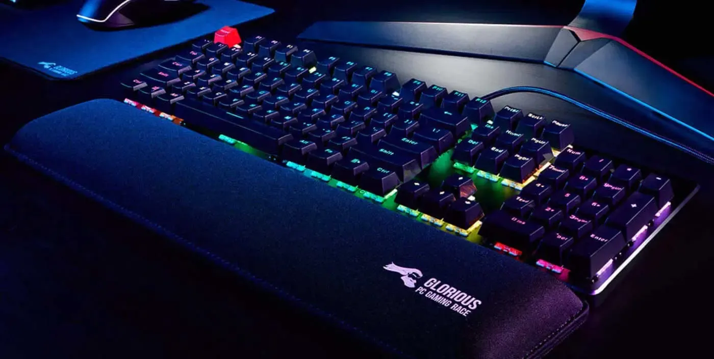 Glorious Stealth Edition compact padded keyboard wrist rest shown in front of a keyboard
