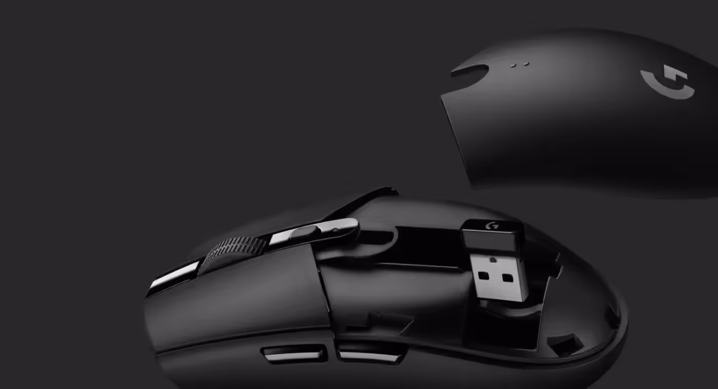 Logitech G305 wireless gaming mouse packed for travel with its USB nano receiver stored inside the body